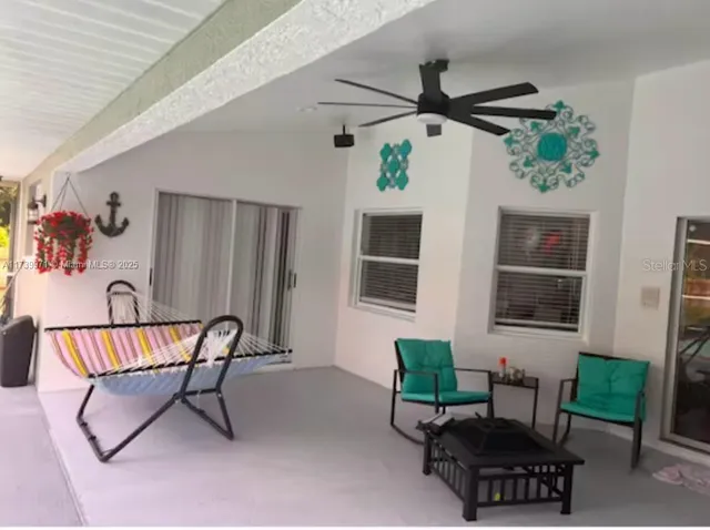 a living room with furniture and a window