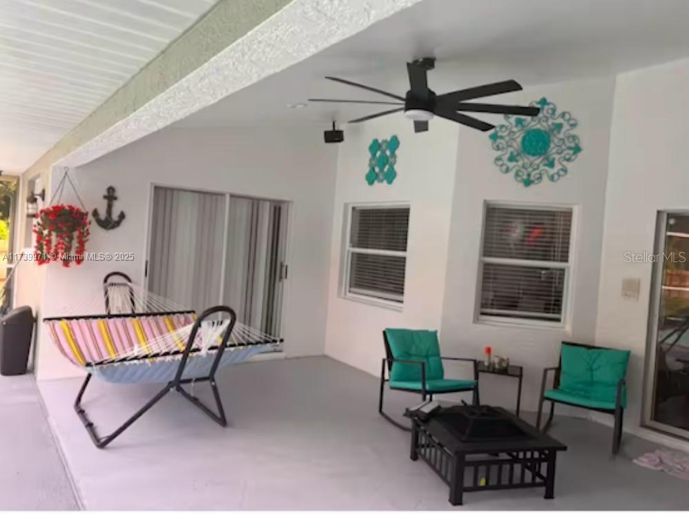 713 Fifth Avenue Lehigh Acres, FL 33972 - Photo 15 of 24 a living room with furniture and a window