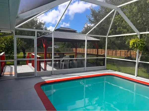 a view of outdoor space with a swimming pool