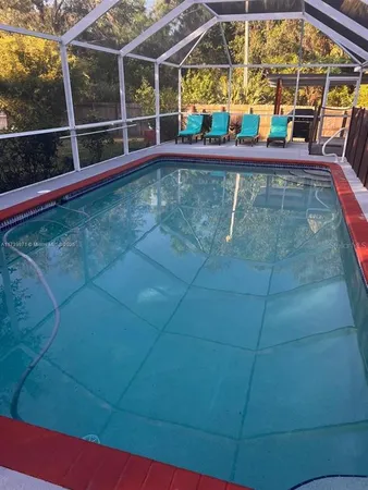 a view of a swimming pool with a patio