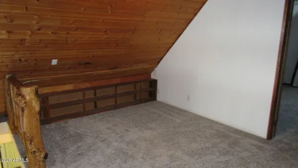 a view of an empty room with an entryway