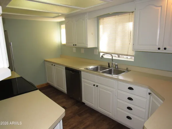a kitchen with a sink and cabinets