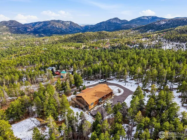 a view of a house with a mountain