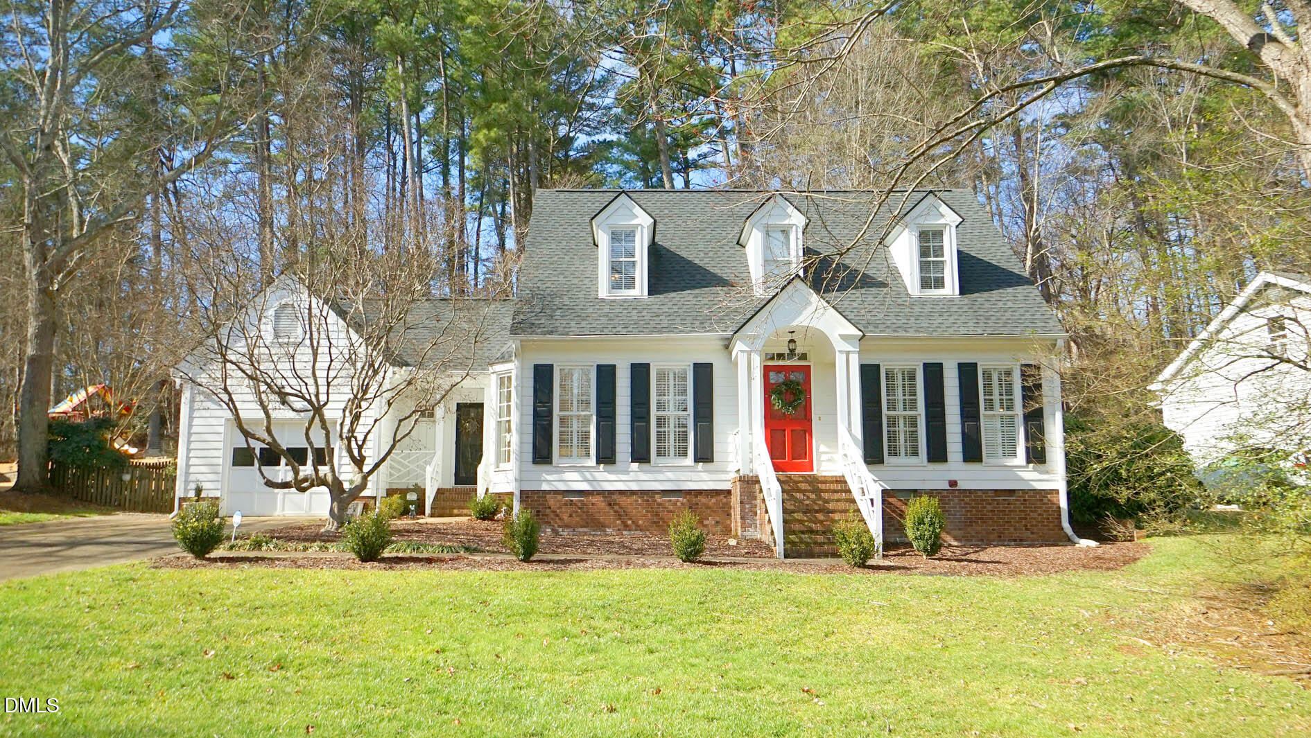 8613 Windjammer Drive Raleigh, NC 27615 - Photo 1 of 52 a front view of a house with a yard