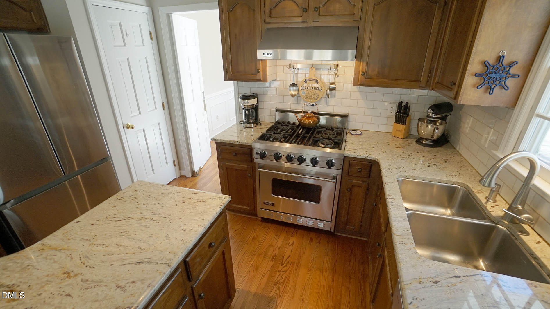 8613 Windjammer Drive Raleigh, NC 27615 - Photo 18 of 52 a kitchen with a stove and a sink