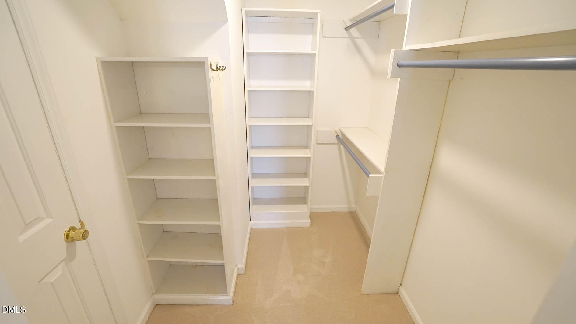 8613 Windjammer Drive Raleigh, NC 27615 - Photo 25 of 52 a view of walk in closet with empty racks