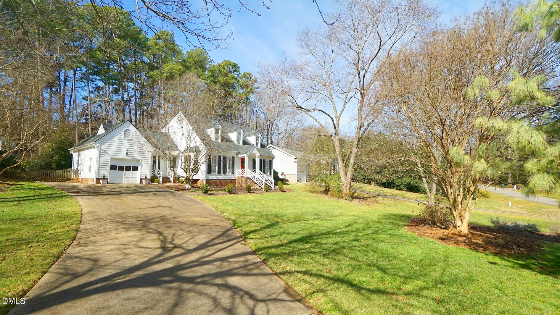 8613 Windjammer Drive Raleigh, NC 27615 - Photo 2 of 52 a view of yard with swimming pool and trees