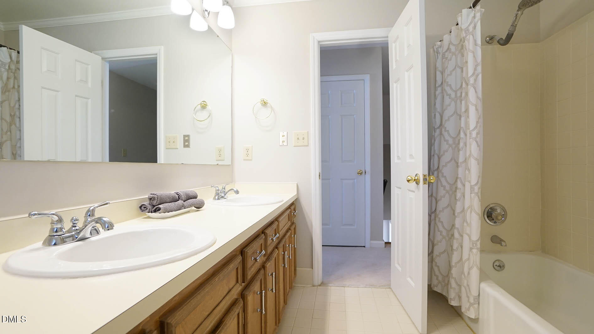 8613 Windjammer Drive Raleigh, NC 27615 - Photo 32 of 52 a bathroom with a sink a toilet and shower