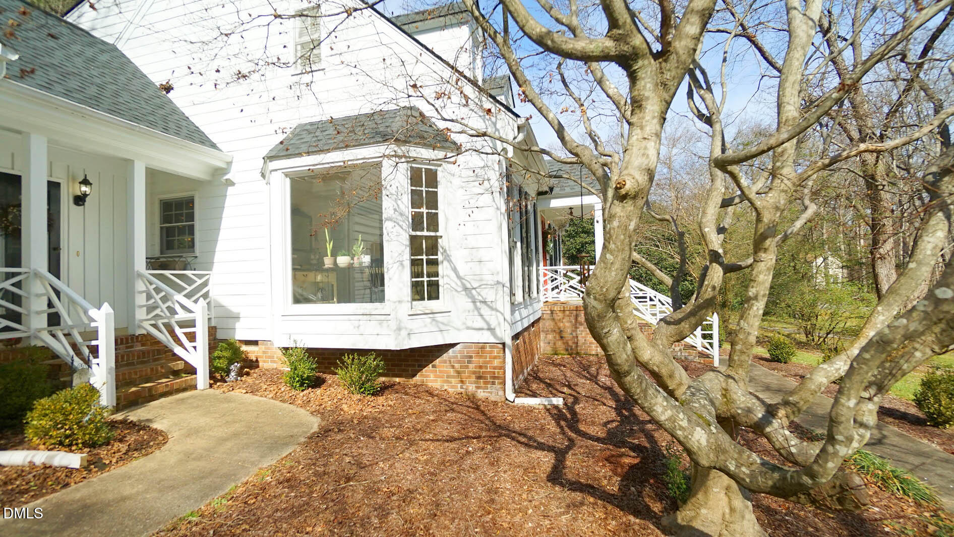 8613 Windjammer Drive Raleigh, NC 27615 - Photo 45 of 52 a view of a house with a large tree