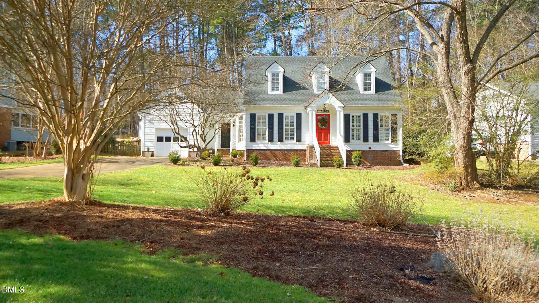 8613 Windjammer Drive Raleigh, NC 27615 - Photo 47 of 52 a view of a house with a yard and large trees