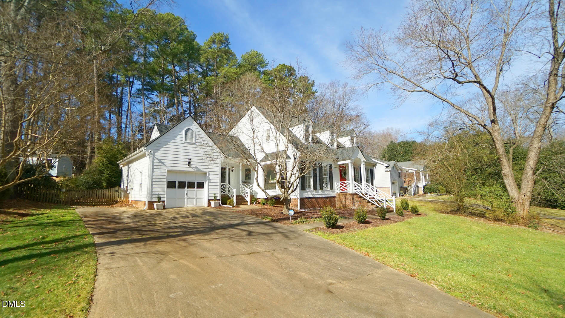 8613 Windjammer Drive Raleigh, NC 27615 - Photo 48 of 52 a front view of a house with a yard