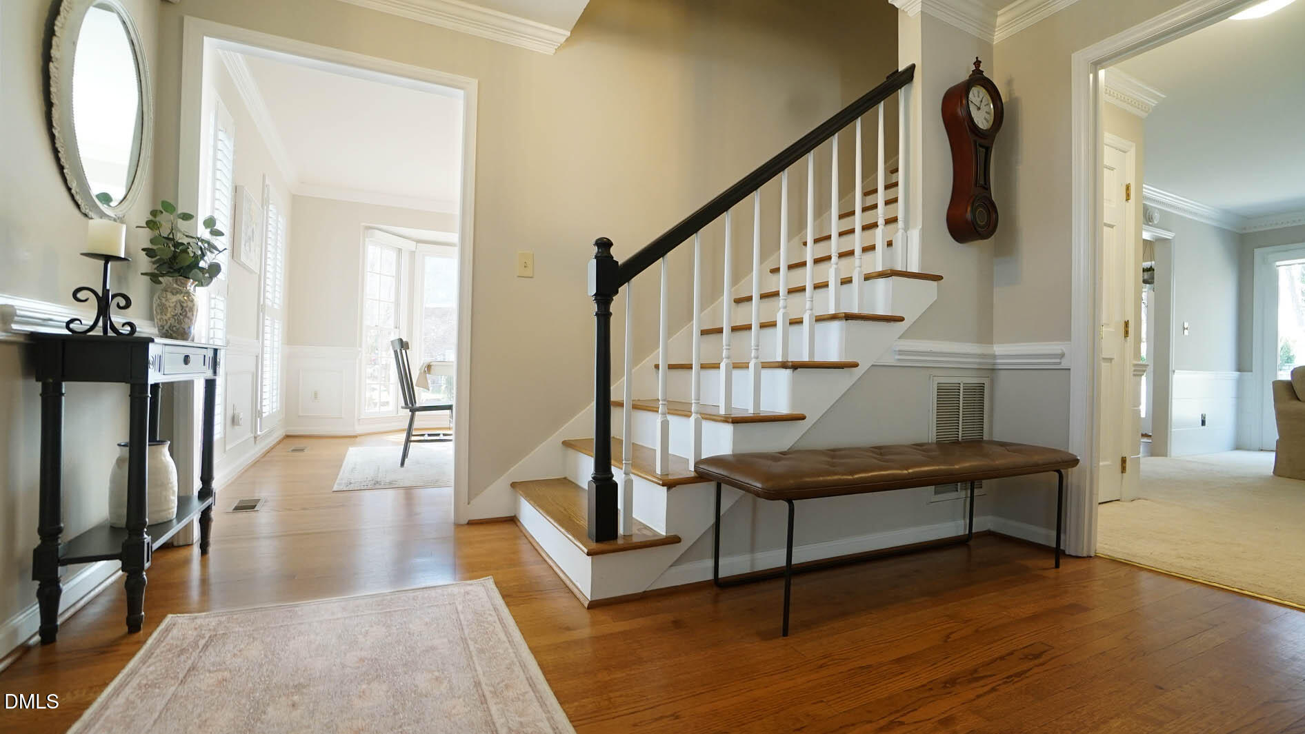 8613 Windjammer Drive Raleigh, NC 27615 - Photo 7 of 52 a view of entryway livingroom and hall with wooden floor
