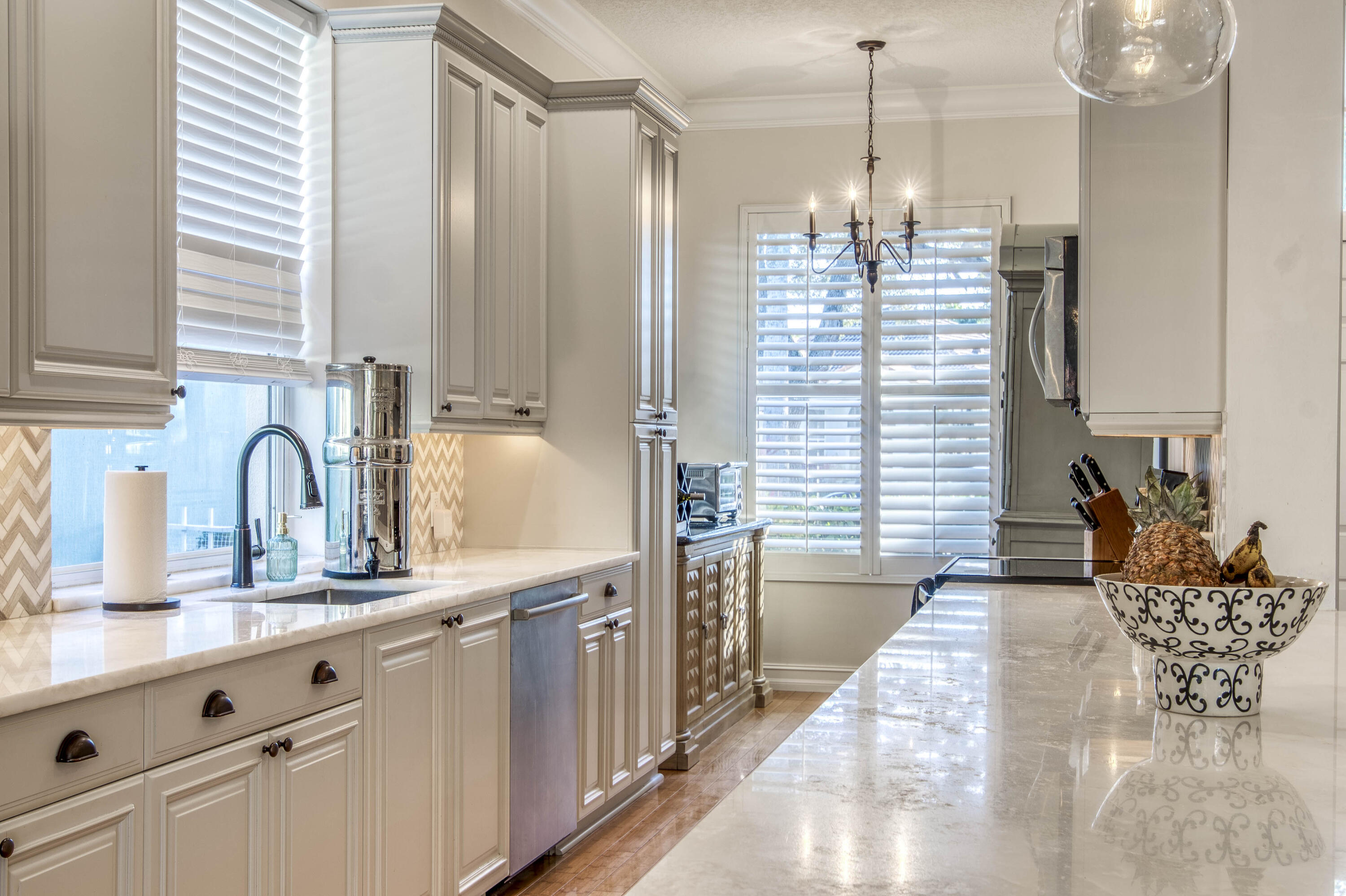 118 East Hampton Way Jupiter, FL 33458 - Photo 12 of 42 a kitchen with kitchen island granite countertop a sink counter top space and cabinets