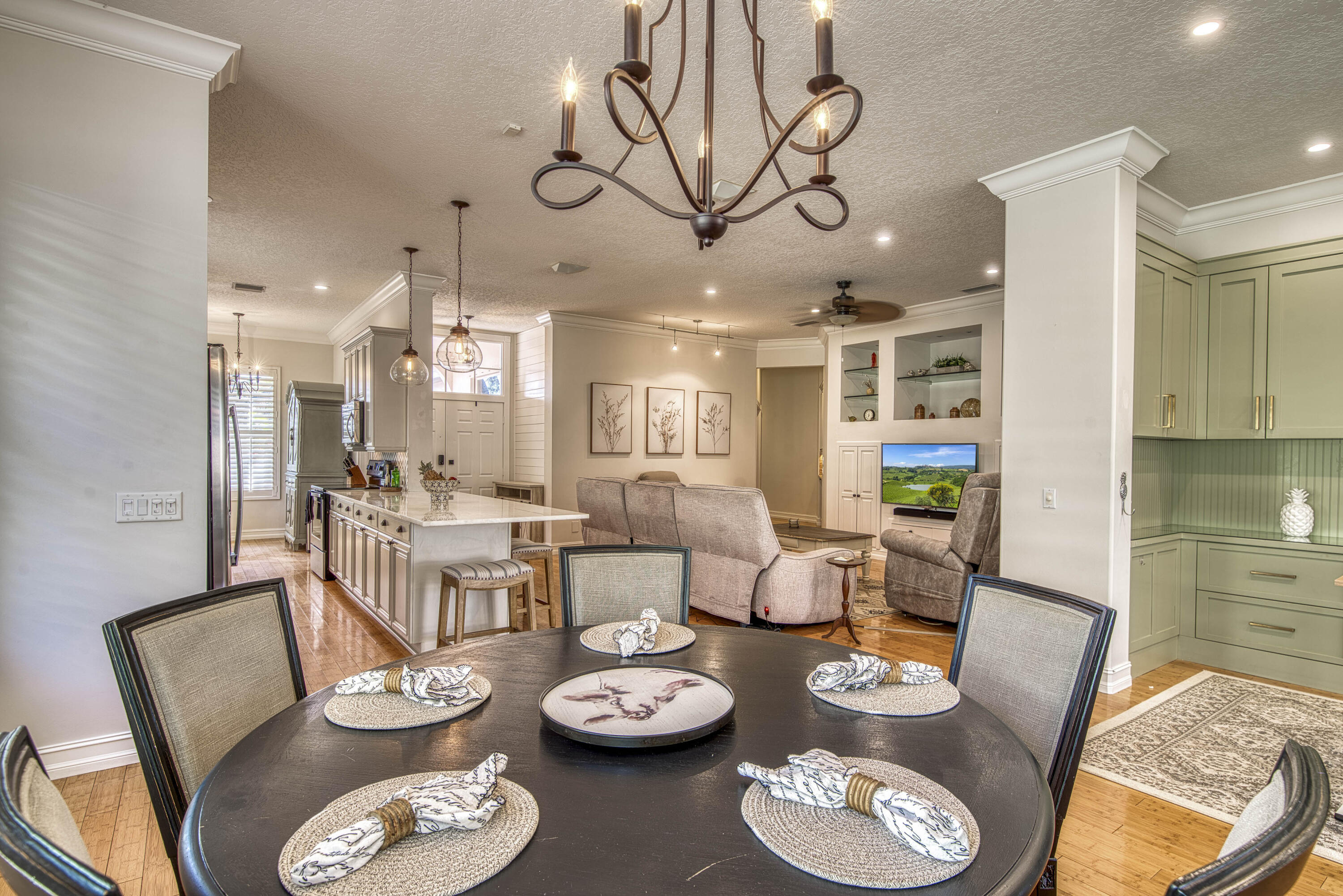 118 East Hampton Way Jupiter, FL 33458 - Photo 16 of 42 a dining room with furniture a rug and wooden floor