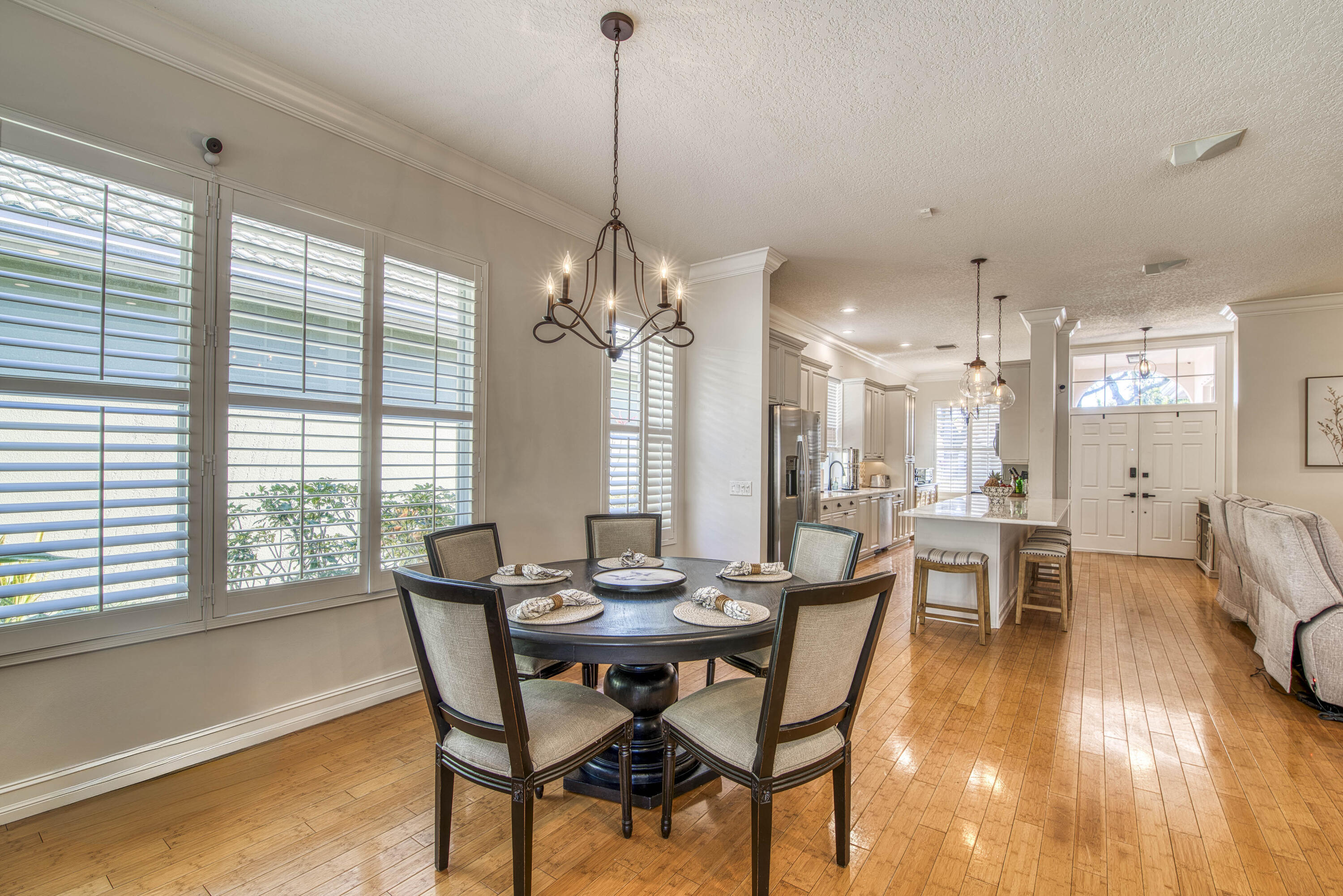 118 East Hampton Way Jupiter, FL 33458 - Photo 17 of 42 a view of a dining room with furniture and wooden floor