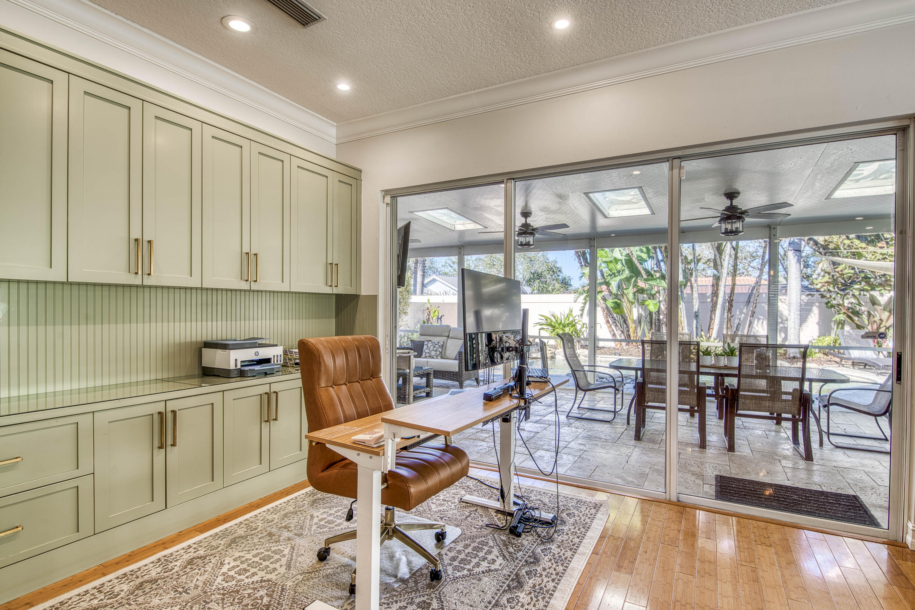 118 East Hampton Way Jupiter, FL 33458 - Photo 18 of 42 a dining room with wooden floor a glass table and chairs