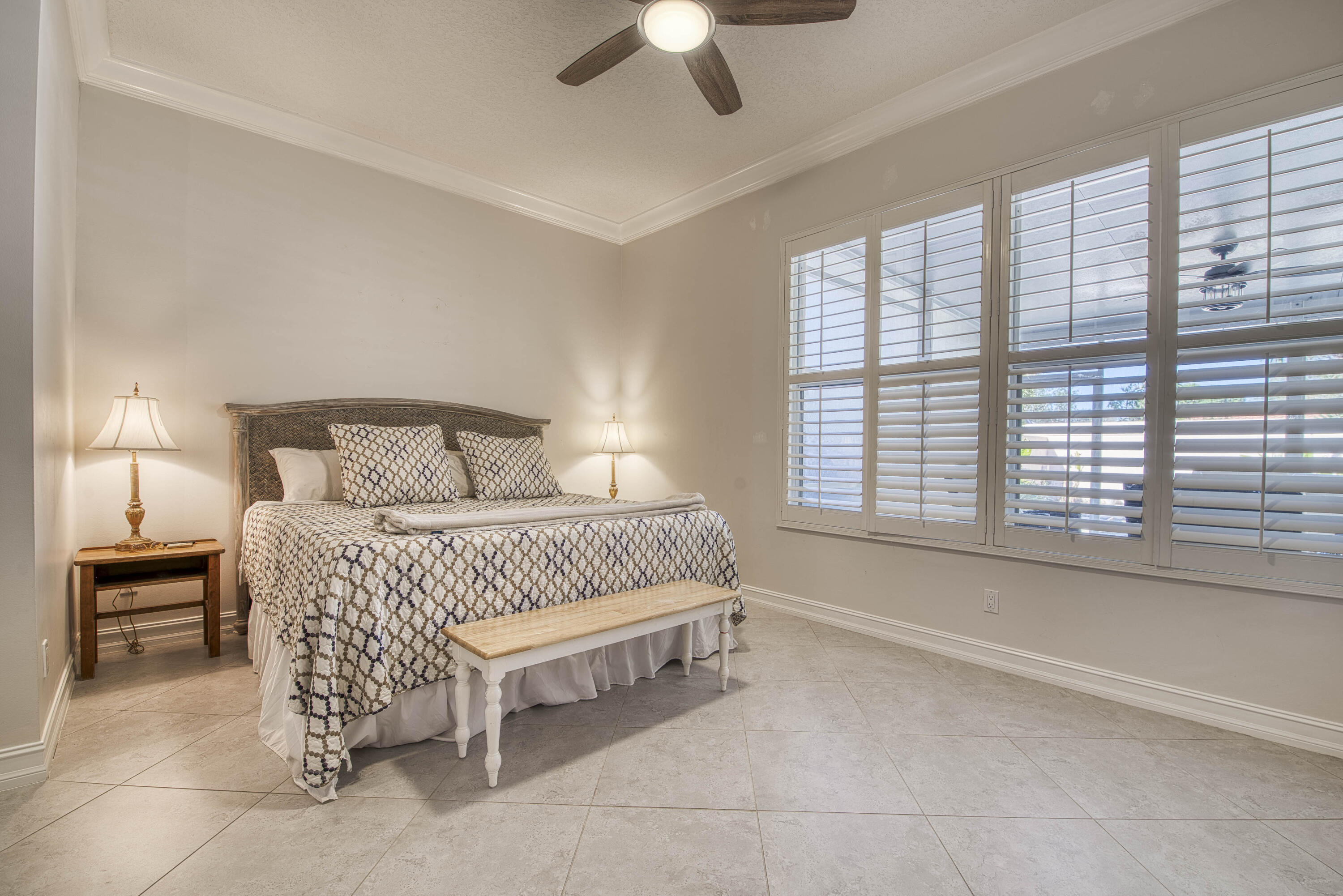 118 East Hampton Way Jupiter, FL 33458 - Photo 19 of 42 a bedroom with a bed and a large window