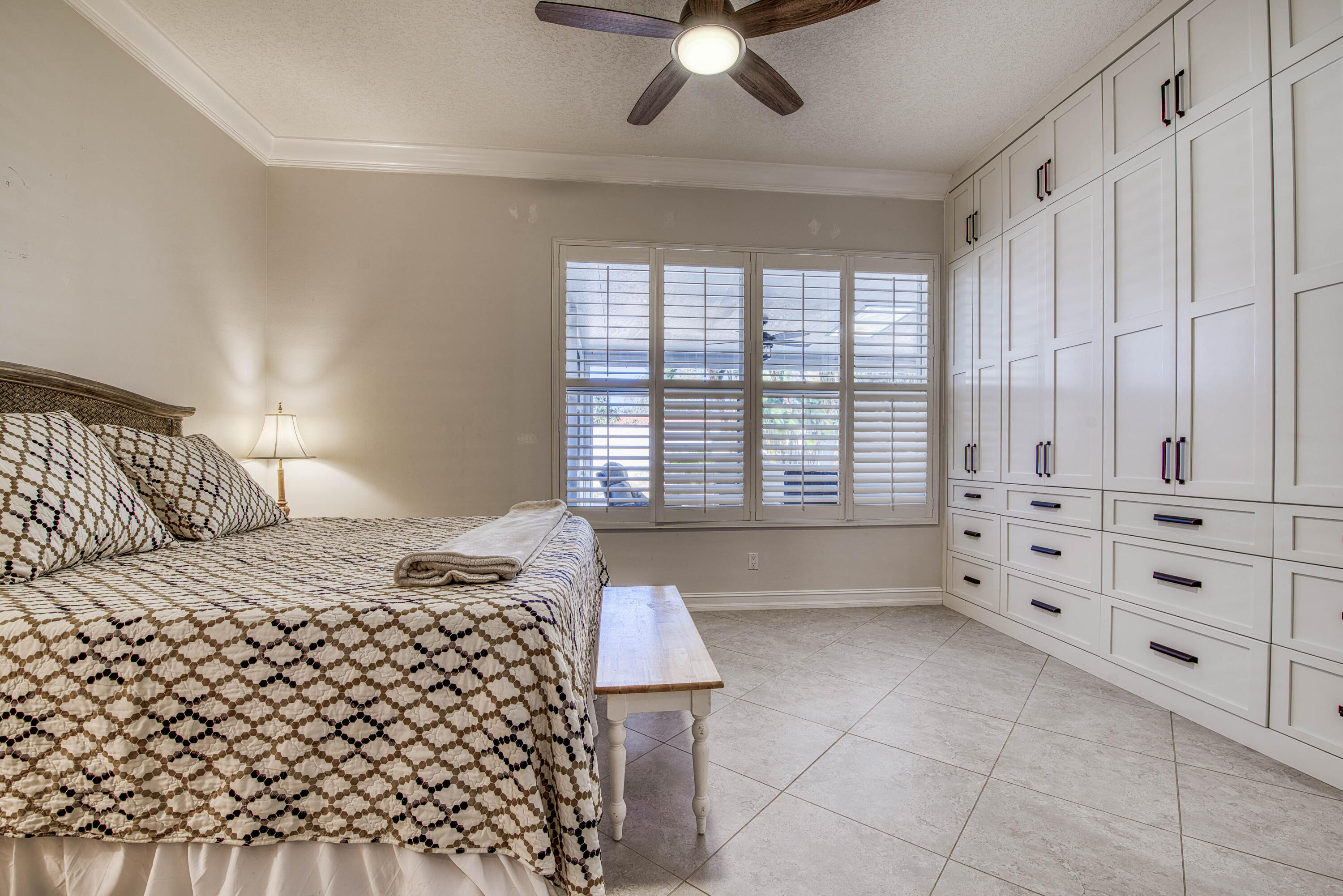 118 East Hampton Way Jupiter, FL 33458 - Photo 20 of 42 a bedroom with a bed and a window