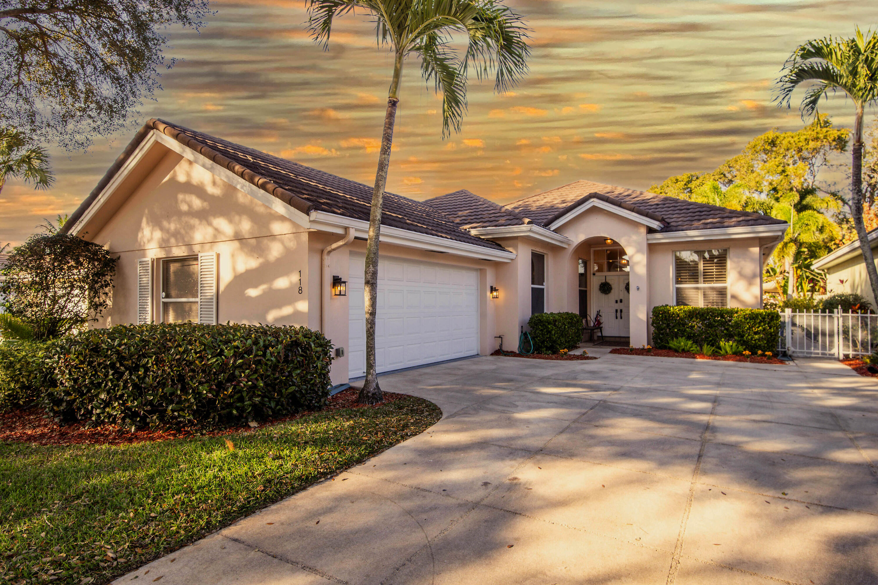 118 East Hampton Way Jupiter, FL 33458 - Photo 2 of 42 a view of a house with a yard