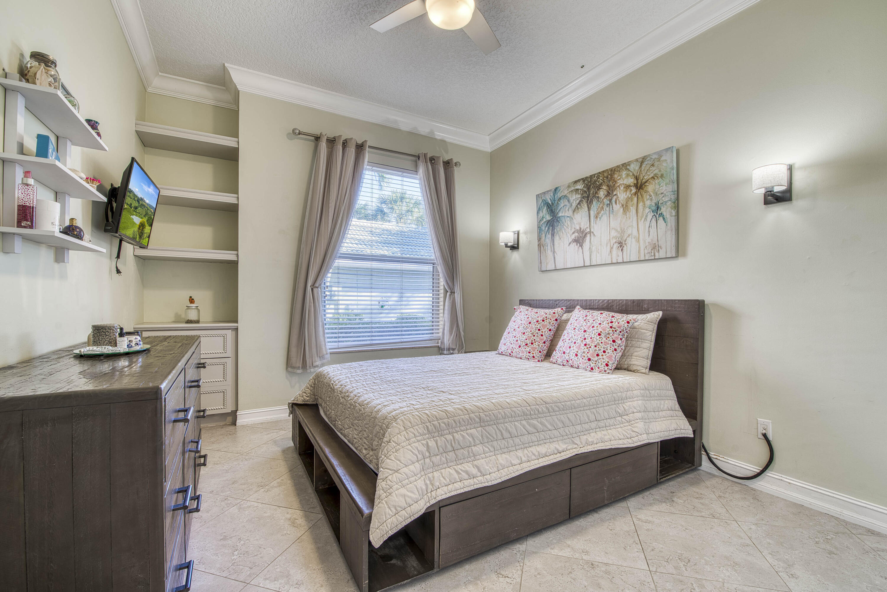 118 East Hampton Way Jupiter, FL 33458 - Photo 27 of 42 a bedroom with a bed and a chandelier