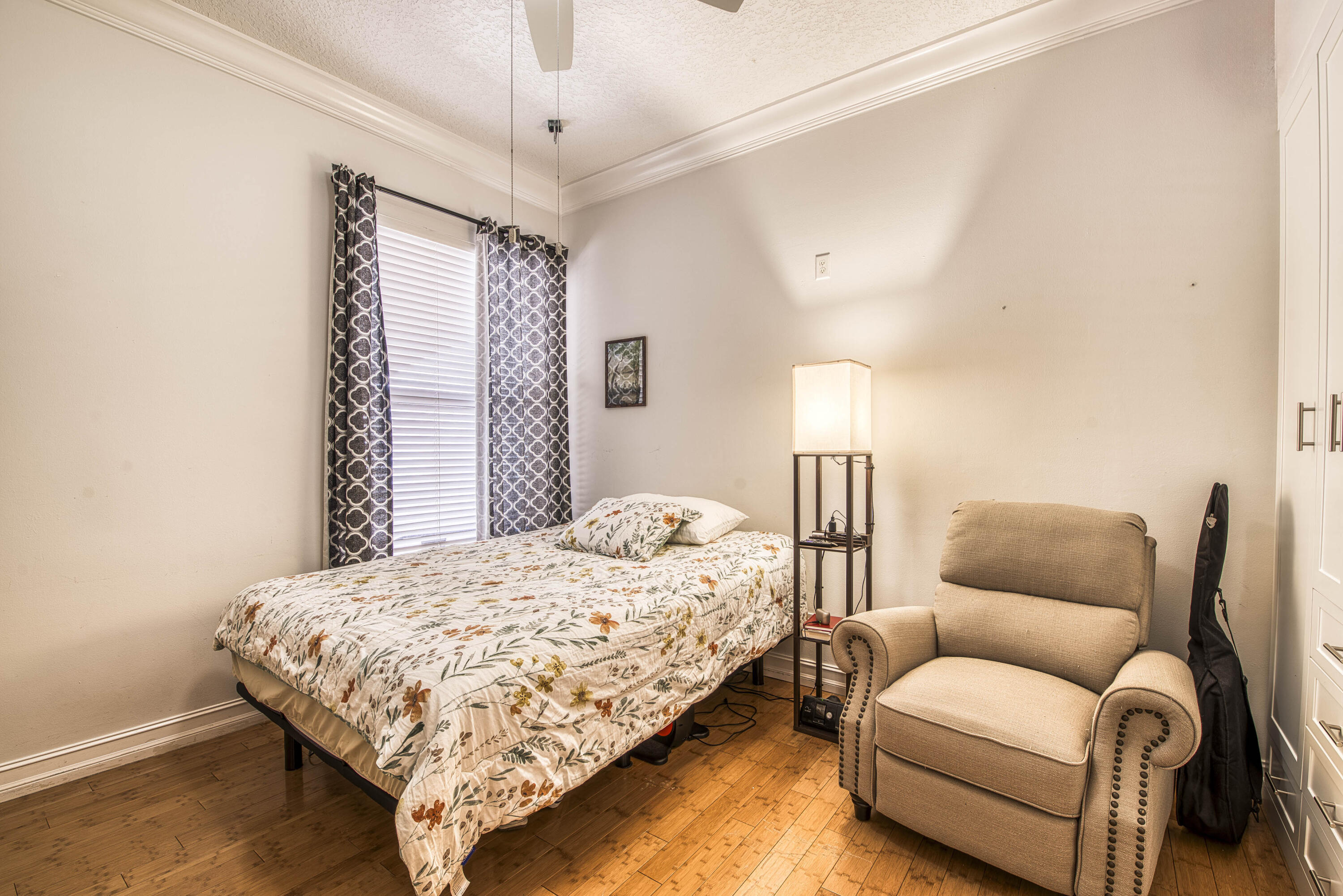 118 East Hampton Way Jupiter, FL 33458 - Photo 29 of 42 a bedroom with a bed couch and window