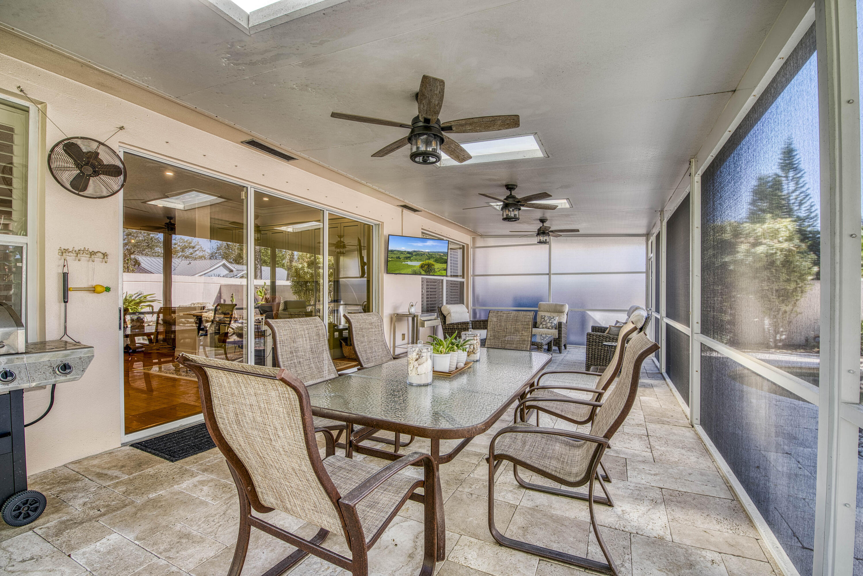 118 East Hampton Way Jupiter, FL 33458 - Photo 33 of 42 a dining room with furniture and a floor to ceiling window