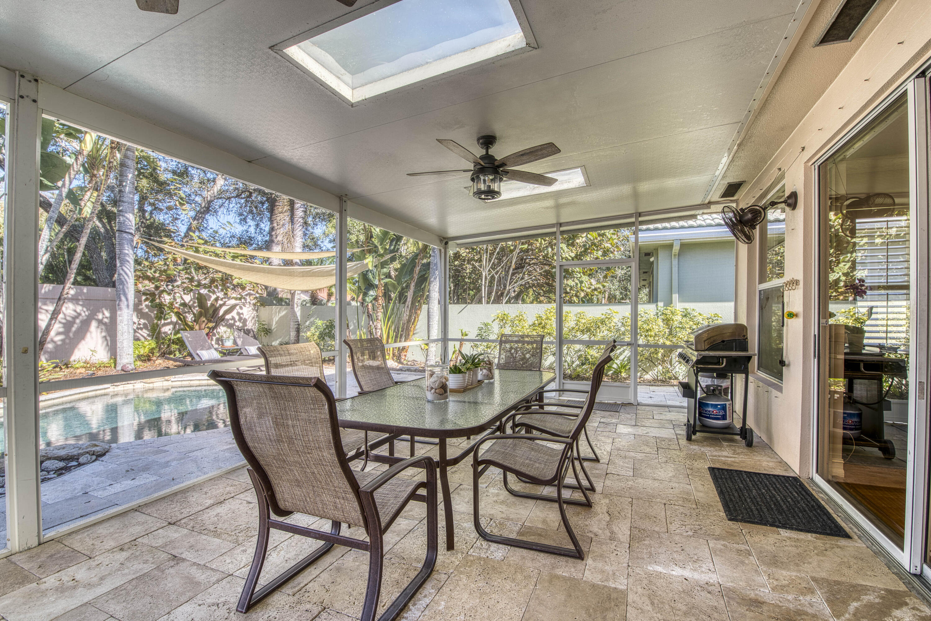 118 East Hampton Way Jupiter, FL 33458 - Photo 34 of 42 a view of a dining room with furniture large windows and wooden floor
