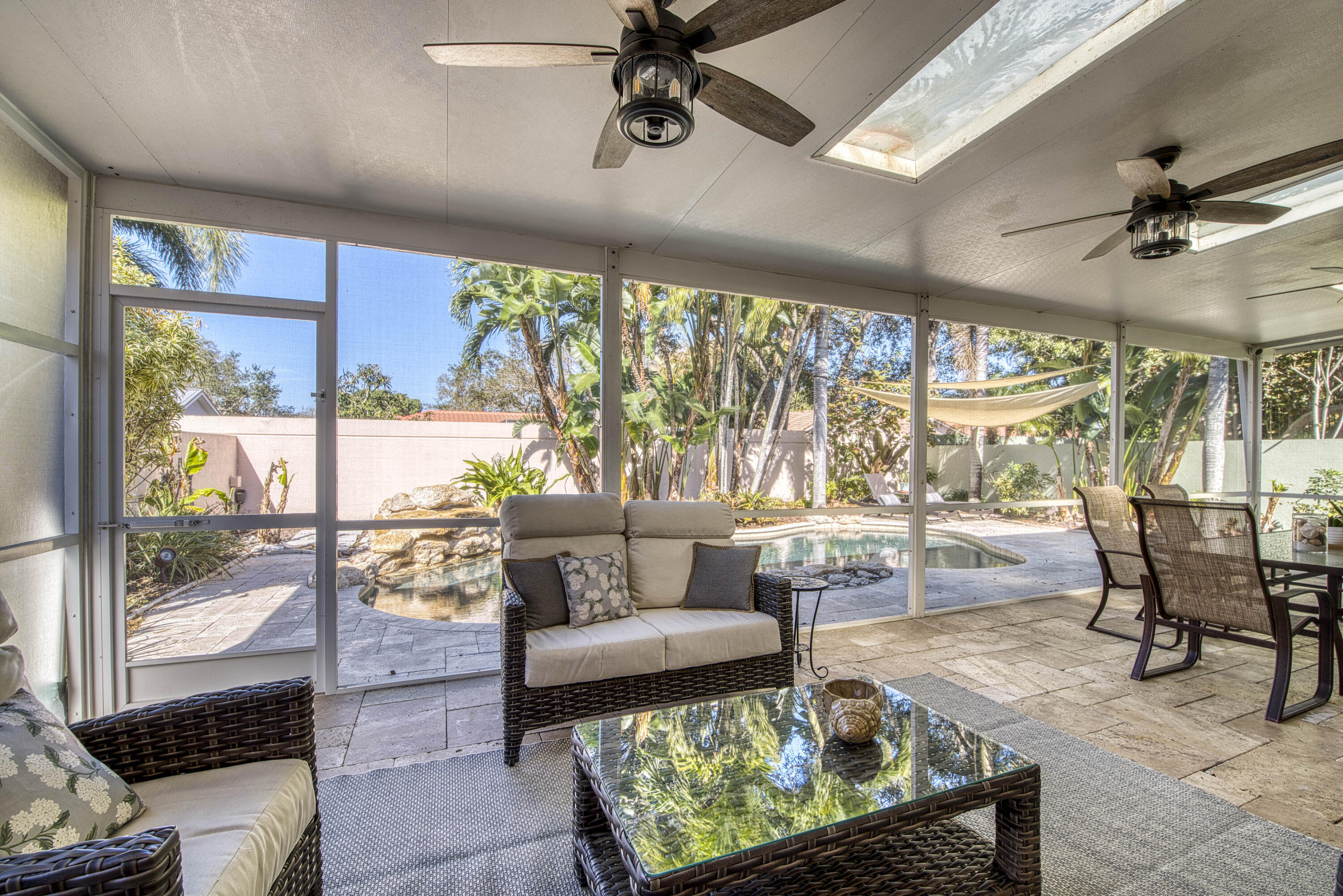 118 East Hampton Way Jupiter, FL 33458 - Photo 36 of 42 a living room with furniture and a floor to ceiling window