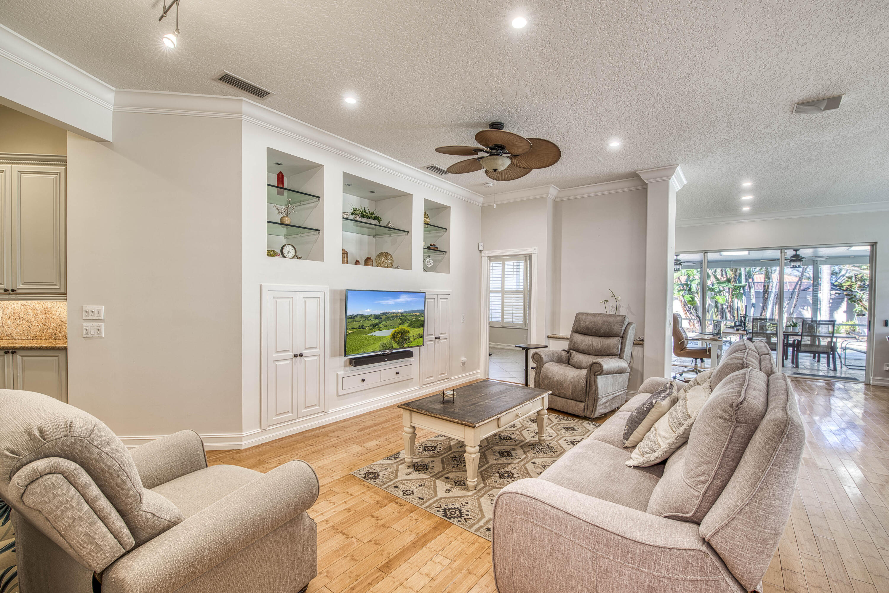 118 East Hampton Way Jupiter, FL 33458 - Photo 6 of 42 a living room with furniture and a flat screen tv