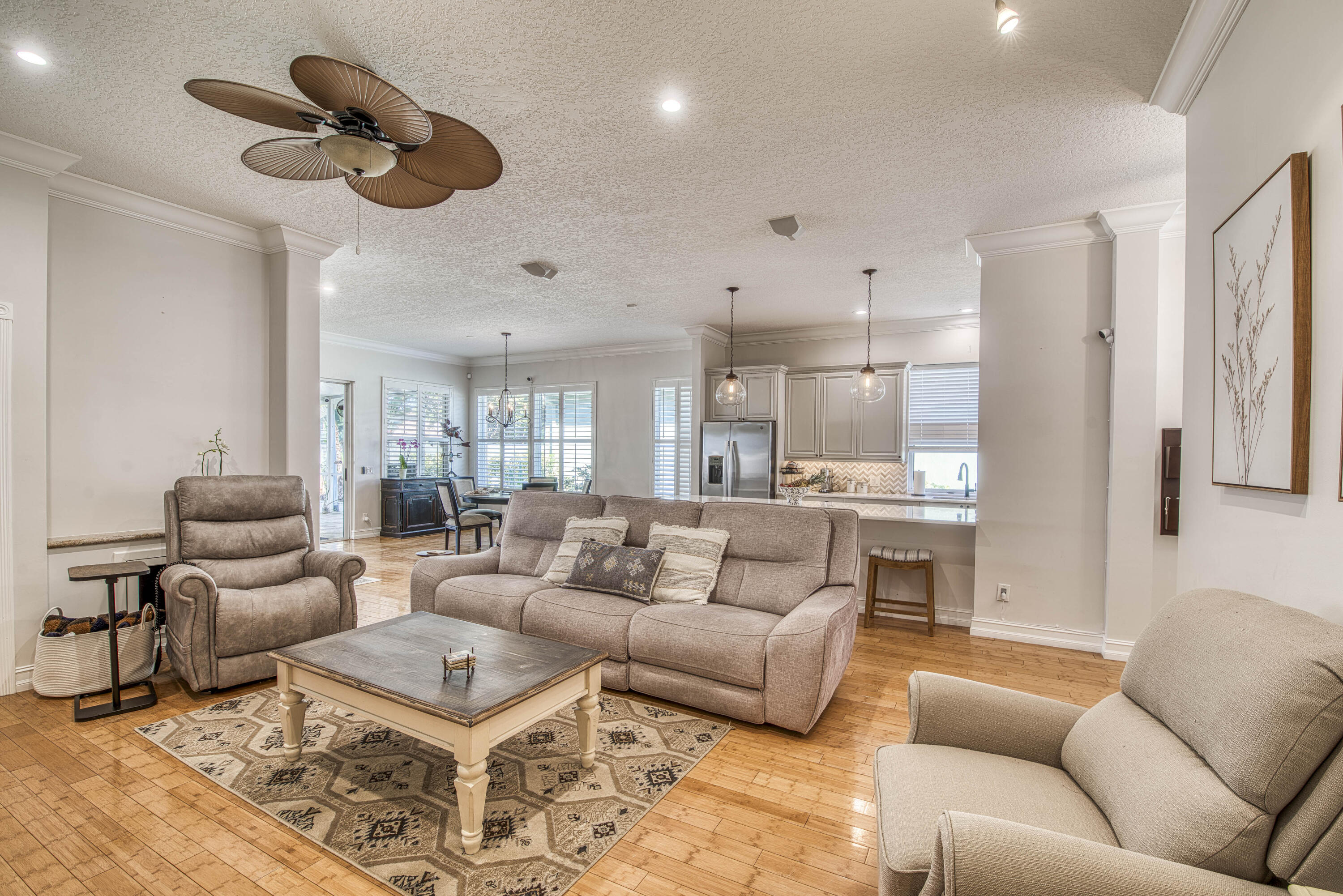 118 East Hampton Way Jupiter, FL 33458 - Photo 7 of 42 a living room with furniture ceiling fan and a rug