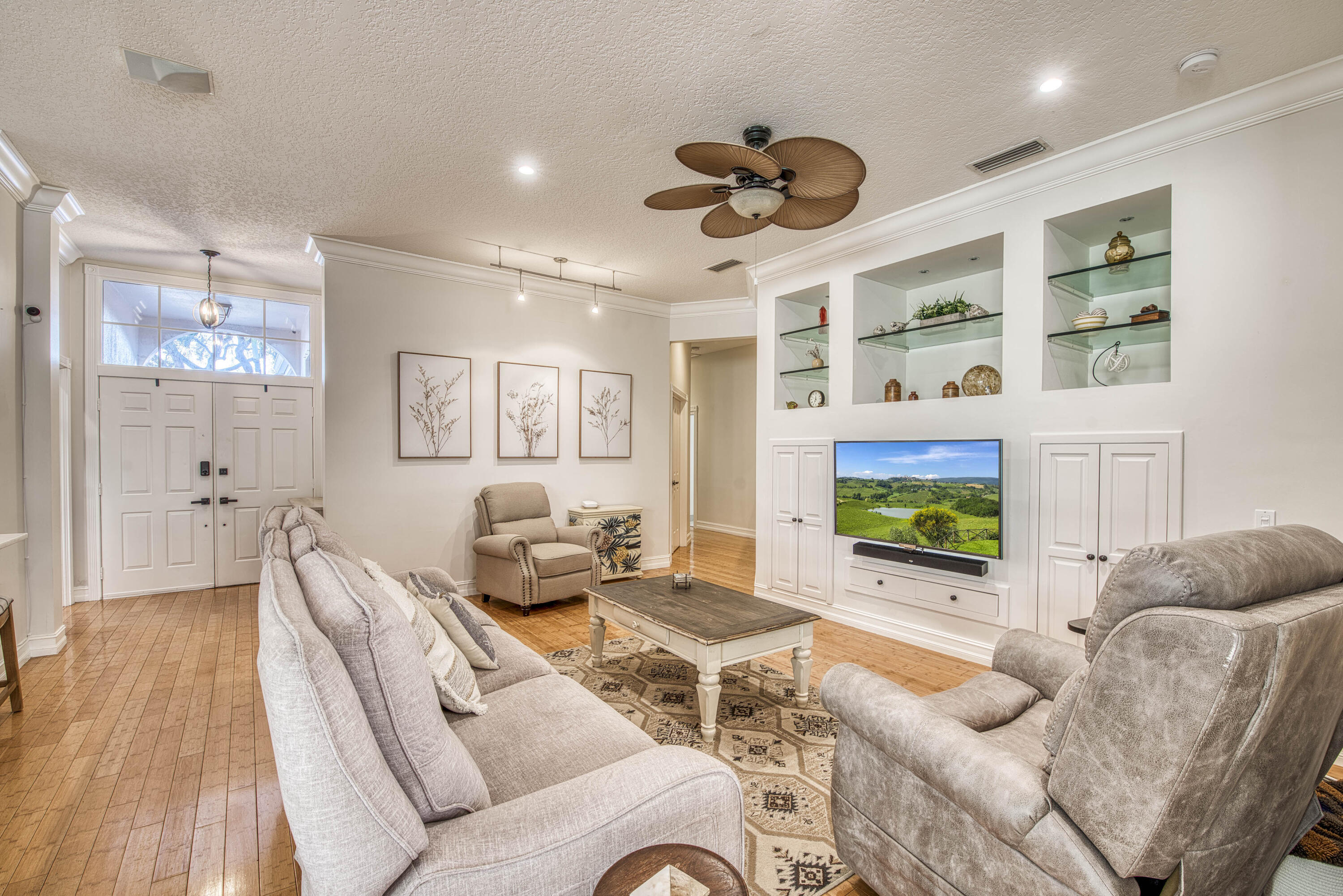 118 East Hampton Way Jupiter, FL 33458 - Photo 8 of 42 a living room with furniture and a flat screen tv