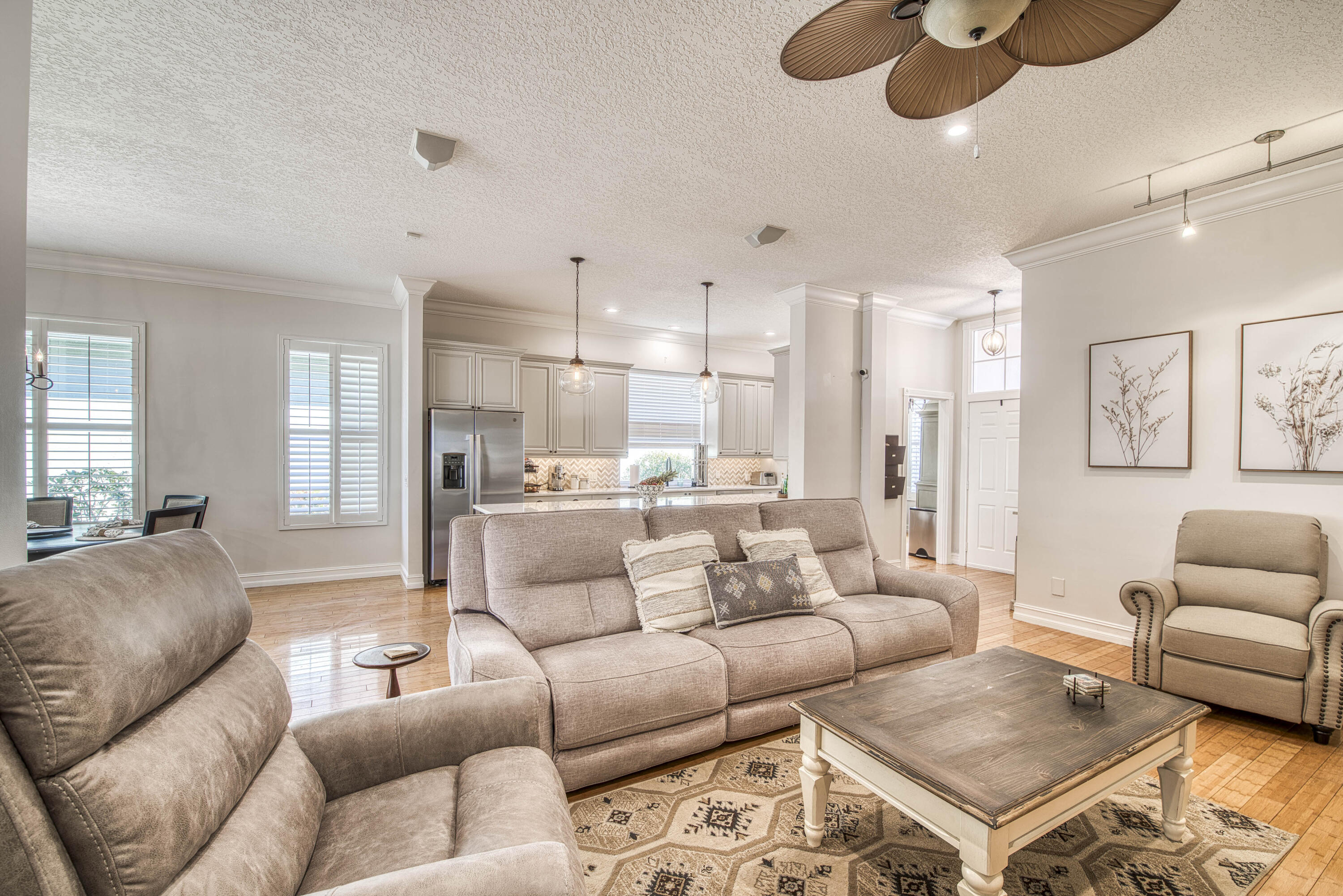 118 East Hampton Way Jupiter, FL 33458 - Photo 9 of 42 a living room with furniture kitchen view and a chandelier