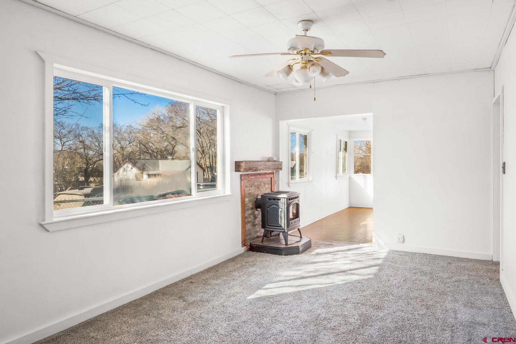 a view of livingroom with furniture and chandelier fan