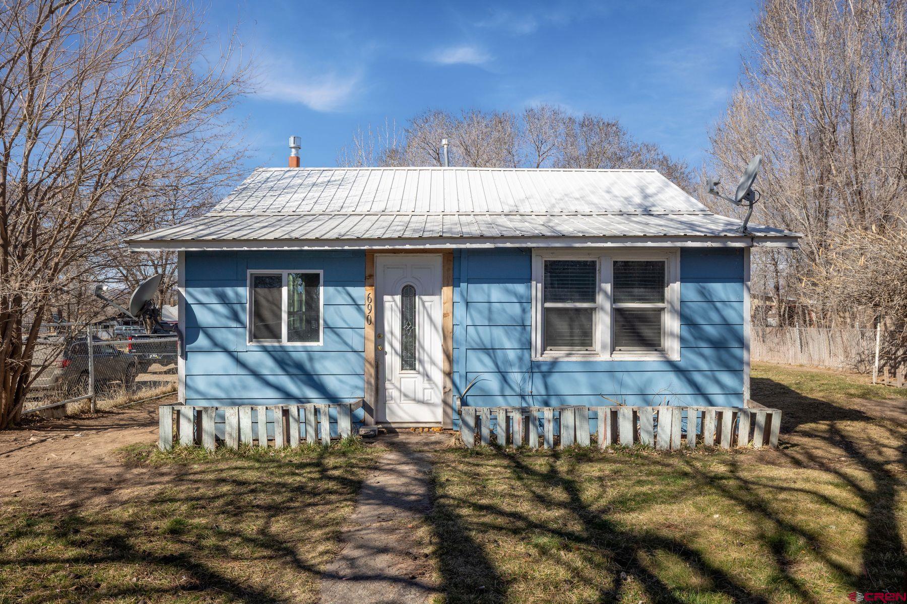 690 Grape Street Nucla, CO 81424 - Photo 11 of 24 a front view of a house with a porch