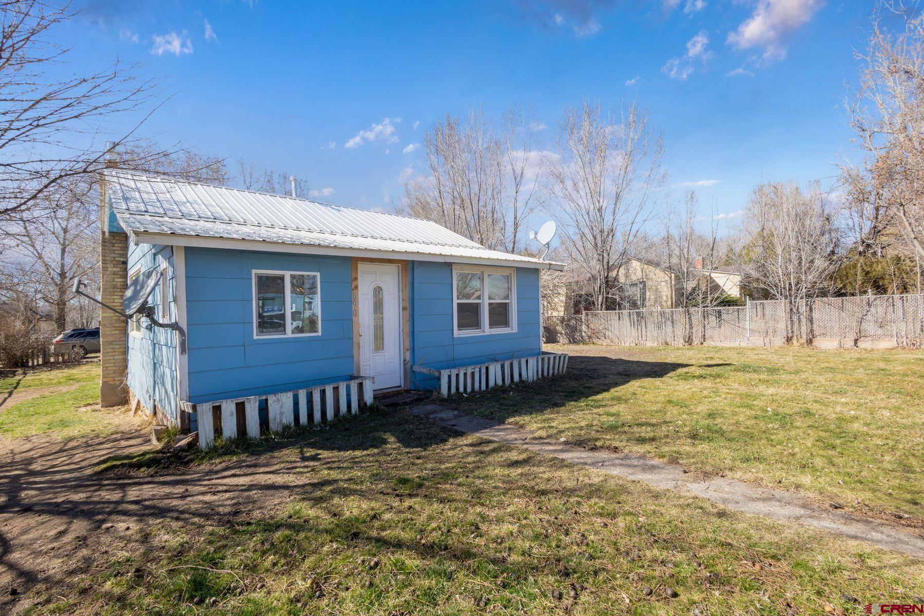 690 Grape Street Nucla, CO 81424 - Photo 12 of 24 a view of a house with a yard