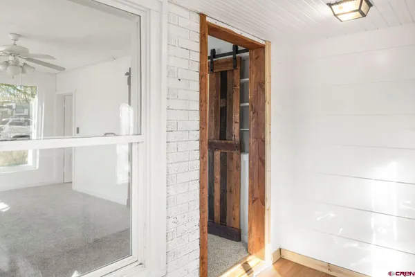 view of a bathroom with a glass door and shower