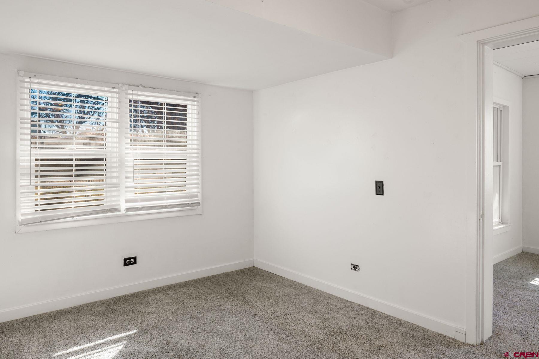 690 Grape Street Nucla, CO 81424 - Photo 19 of 24 a view of an empty room with a window