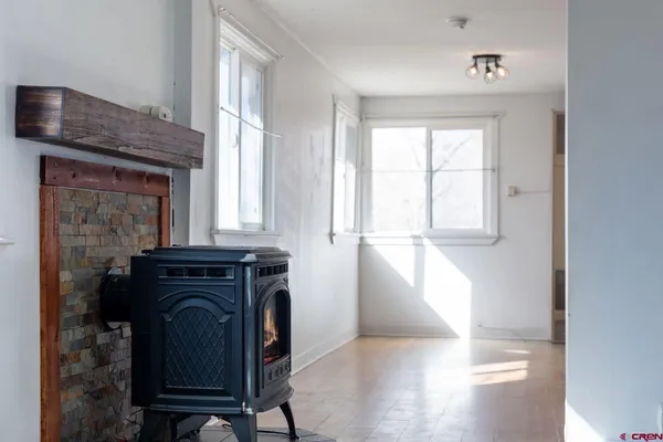 a view of a livingroom with furniture and a window