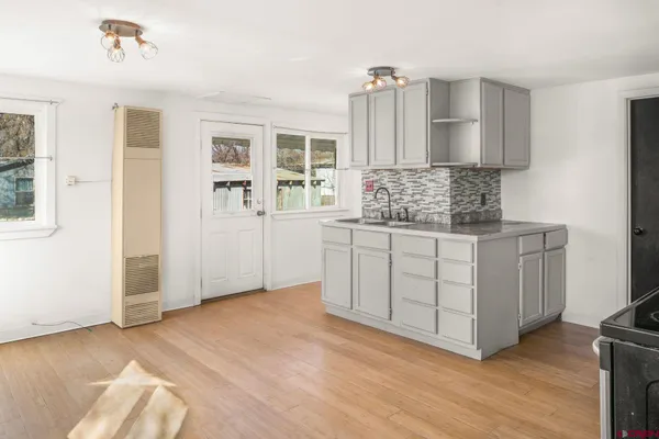 a kitchen with a cabinets and window