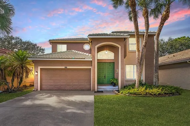 $595,000 | 166 Seminole Lakes Drive, Royal Palm Beach, FL 33411