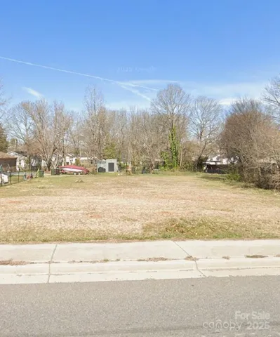 a view of a yard with an ocean view