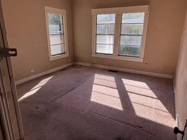 an empty room with windows