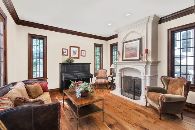 a living room with furniture flat screen tv and a fireplace