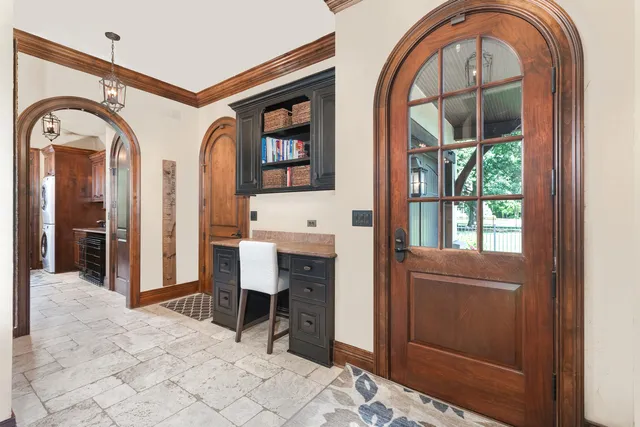 a bathroom with a granite countertop toilet sink shower and mirror