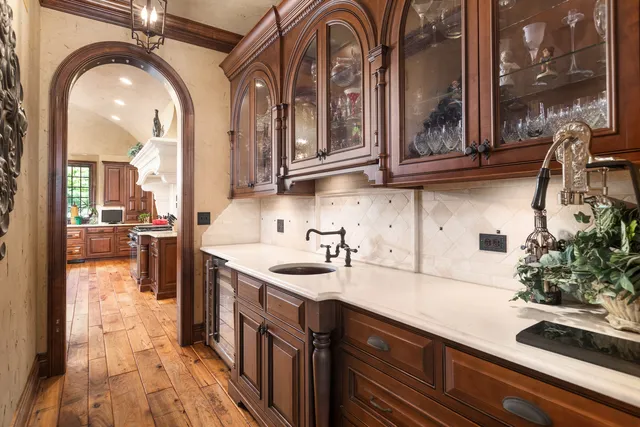 a view of a sink and mirror in bathroom