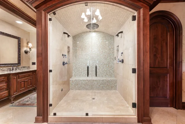 a bathroom with a toilet a sink and a mirror