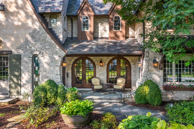 a front view of a house with garden