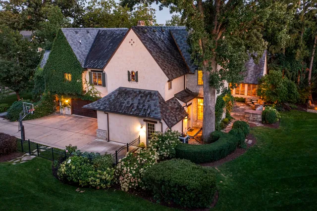 a view of a backyard with sitting area furniture and garden