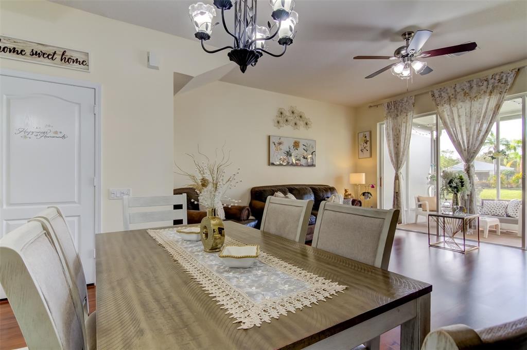 26642 Castleview Way Wesley Chapel, FL 33544 - Photo 14 of 50 a living room with furniture and a chandelier