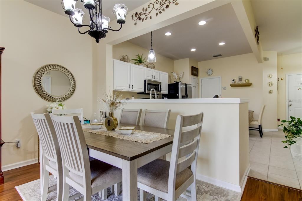 26642 Castleview Way Wesley Chapel, FL 33544 - Photo 18 of 50 a view of a dining room with furniture and chandelier